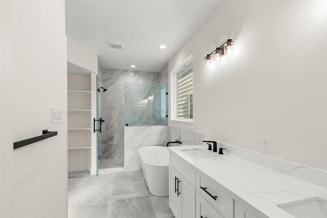 full bath featuring marble look tile flooring, a marble finish shower, a soaking tub, recessed lighting, and double vanity
