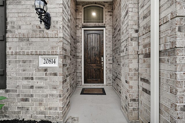 20814 Silver Lance Dr, Tomball, TX 77375 - view of exterior entry featuring brick siding