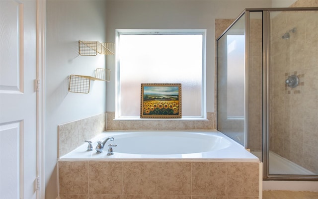 full bath with a stall shower and a bath
