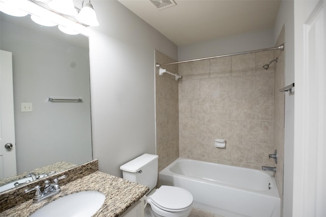 bathroom with toilet, vanity, and washtub / shower combination