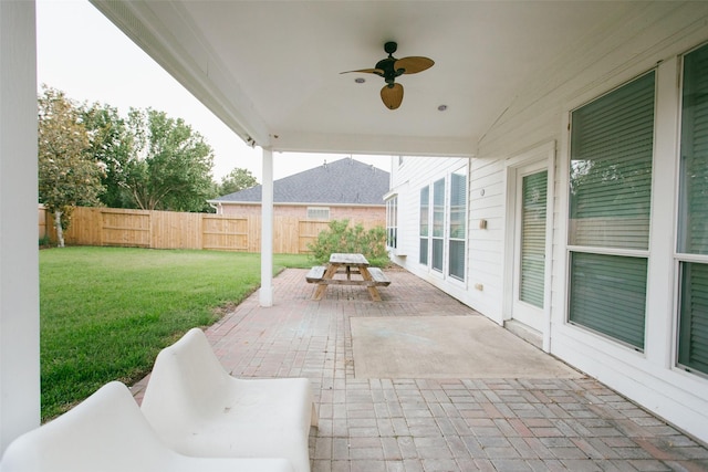 view of patio featuring outdoor dining space and a ceiling fan