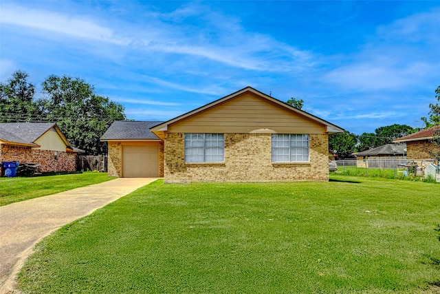 742 Pine Ave, Hempstead, TX 77445 - ranch-style house with concrete driveway, brick siding, and a garage