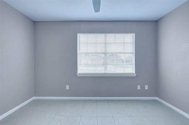 742 Pine Ave, Hempstead, TX 77445 - empty room with a ceiling fan, baseboards, and light tile patterned floors