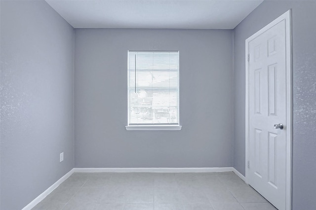 742 Pine Ave, Hempstead, TX 77445 - spare room with light tile patterned floors and baseboards