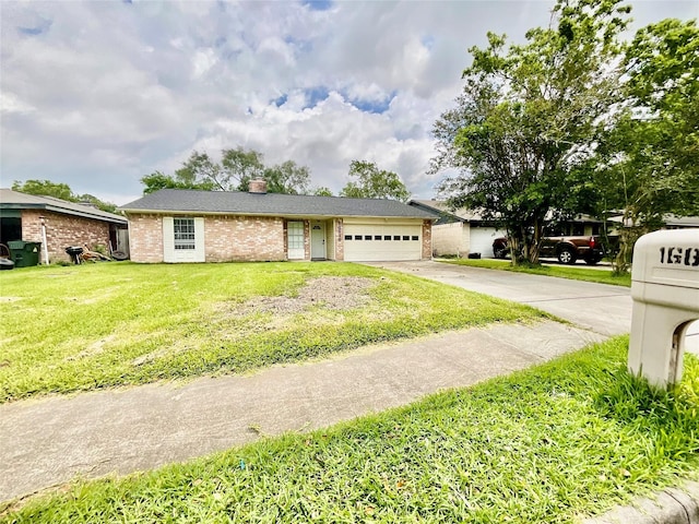 ranch-style home featuring an attached garage, driveway, a chimney, a front yard, and brick siding