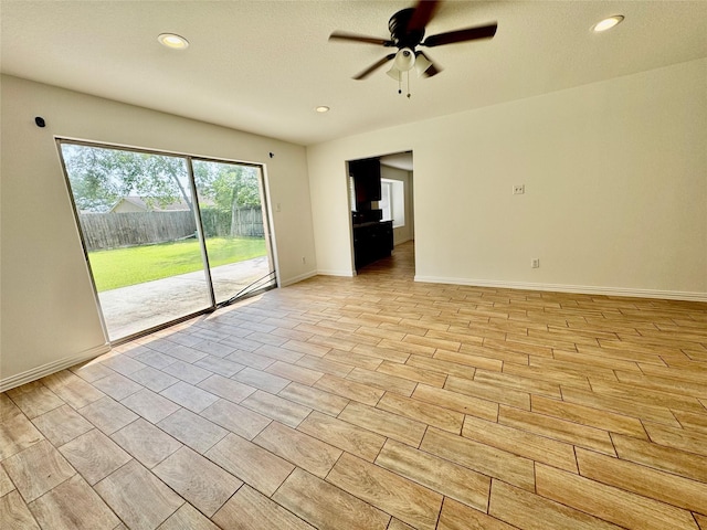 unfurnished room featuring a ceiling fan, recessed lighting, and baseboards