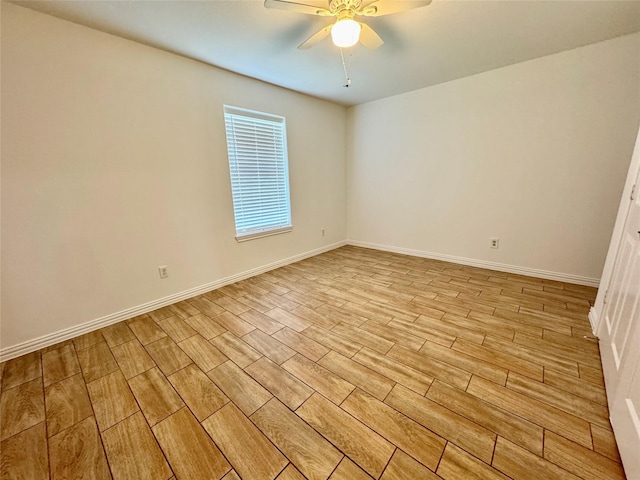 empty room with light wood-style floors, ceiling fan, and baseboards
