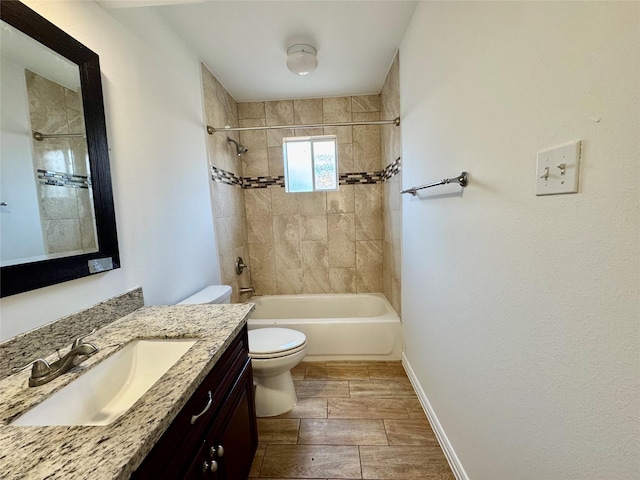 bathroom with toilet, bathtub / shower combination, vanity, and wood finished floors