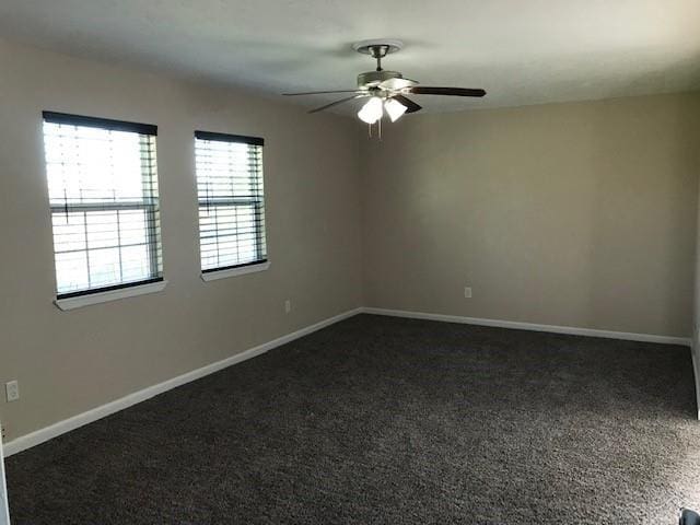 13702 Towne Way Dr, Sugar Land, TX 77498 - unfurnished room with ceiling fan, dark carpet, and baseboards