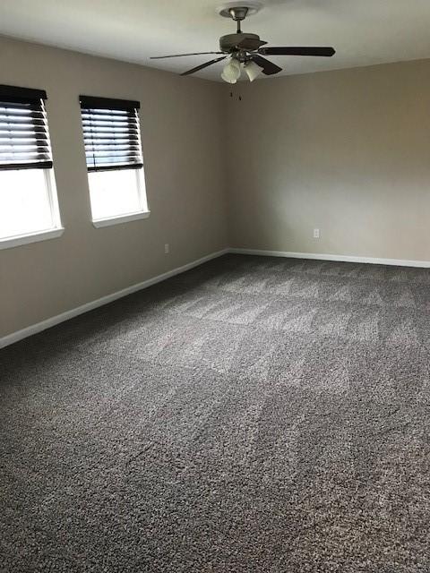13702 Towne Way Dr, Sugar Land, TX 77498 - carpeted empty room with ceiling fan and baseboards