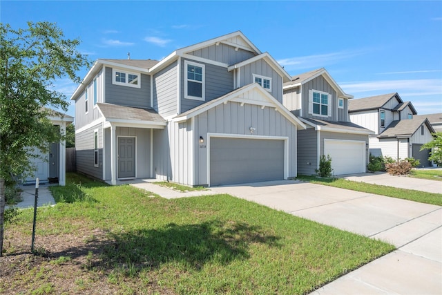 view of front of house featuring board and batten siding, driveway, a garage, and a front yard
