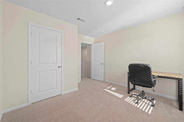 carpeted office space featuring baseboards