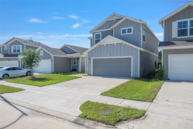 view of front of home with board and batten siding, driveway, and a front lawn