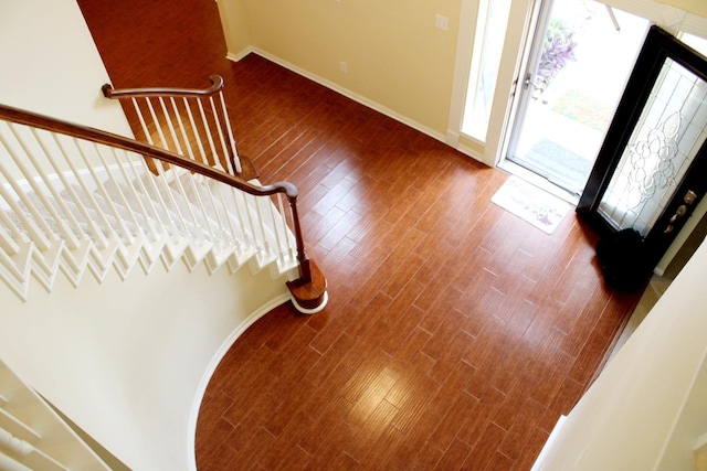 20003 Powerscourt Dr, Humble, TX 77346 - foyer entrance featuring baseboards, dark wood-style floors, and stairs