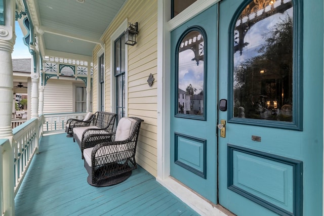 view of exterior entry with covered porch