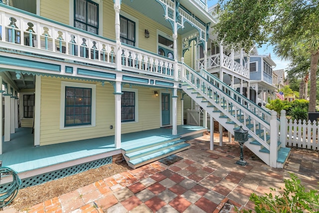 surrounding community featuring stairway and fence