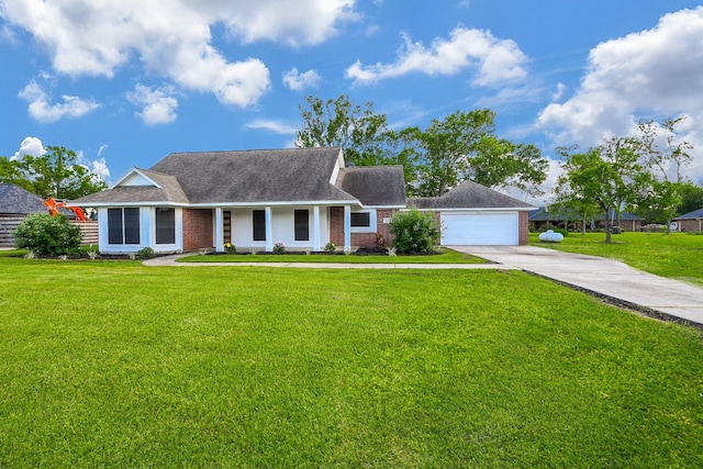 6002 Redfish Run, Baytown, TX 77523 - view of front of house with concrete driveway, brick siding, a front yard, and an attached garage