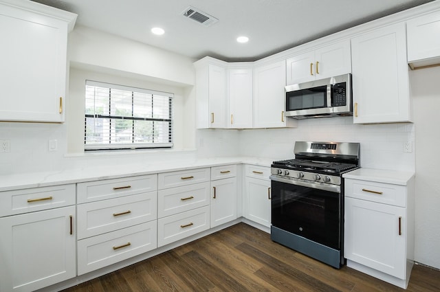 6002 Redfish Run, Baytown, TX 77523 - kitchen with appliances with stainless steel finishes, white cabinetry, and recessed lighting