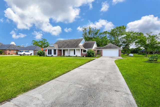 6002 Redfish Run, Baytown, TX 77523 - view of front of house with a front lawn, a garage, concrete driveway, and brick siding