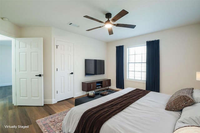 6002 Redfish Run, Baytown, TX 77523 - bedroom featuring wood finished floors, baseboards, and a ceiling fan