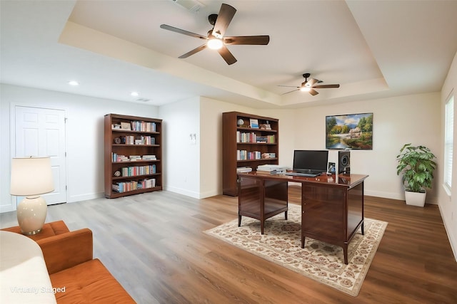 6002 Redfish Run, Baytown, TX 77523 - office with ceiling fan, baseboards, a raised ceiling, wood finished floors, and recessed lighting