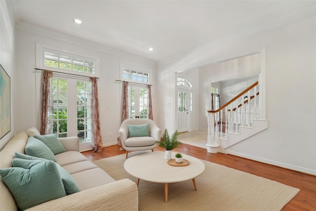 1706 Lofty Maple Trl, Houston, TX 77345 - living room with crown molding, wood finished floors, stairway, baseboards, and recessed lighting
