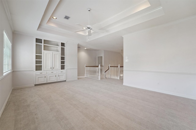 1706 Lofty Maple Trl, Houston, TX 77345 - spare room featuring a raised ceiling, ornamental molding, light colored carpet, baseboards, and a ceiling fan