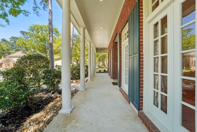 1706 Lofty Maple Trl, Houston, TX 77345 - view of patio featuring a porch and french doors