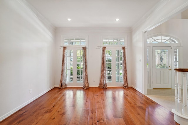 1706 Lofty Maple Trl, Houston, TX 77345 - foyer featuring french doors, wood-type flooring, ornamental molding, baseboards, and recessed lighting