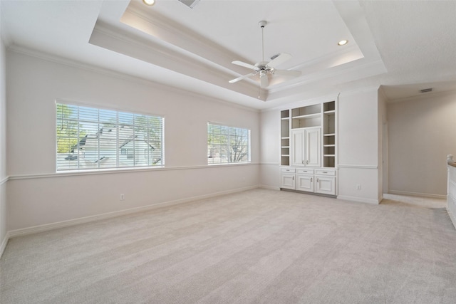 1706 Lofty Maple Trl, Houston, TX 77345 - empty room with a raised ceiling, crown molding, light colored carpet, a ceiling fan, and baseboards