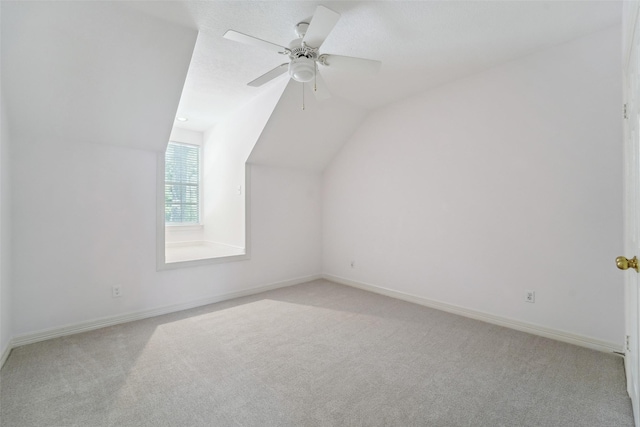 1706 Lofty Maple Trl, Houston, TX 77345 - additional living space with carpet flooring, lofted ceiling, baseboards, and a ceiling fan