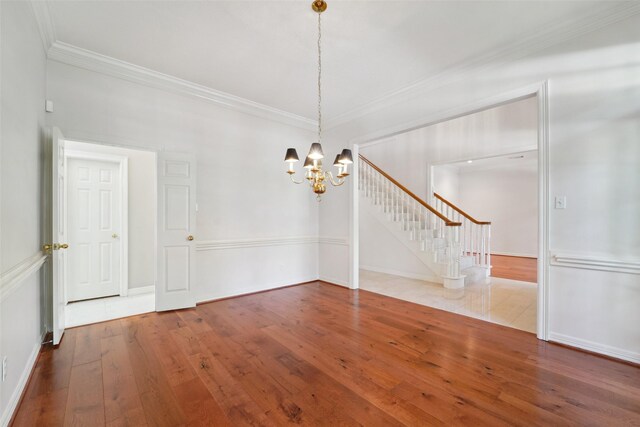1706 Lofty Maple Trl, Houston, TX 77345 - unfurnished dining area with crown molding, hardwood / wood-style flooring, stairs, and a chandelier