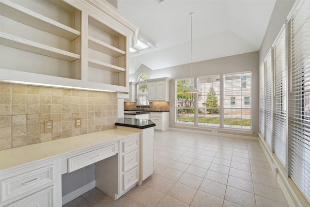 1706 Lofty Maple Trl, Houston, TX 77345 - kitchen featuring open shelves, backsplash, light tile patterned floors, pendant lighting, and white cabinets