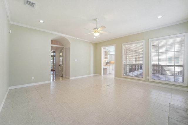 1706 Lofty Maple Trl, Houston, TX 77345 - unfurnished room with arched walkways, ceiling fan, ornamental molding, baseboards, and light tile patterned flooring