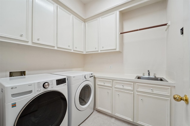 1706 Lofty Maple Trl, Houston, TX 77345 - laundry room with washing machine and clothes dryer, cabinet space, and light tile patterned flooring