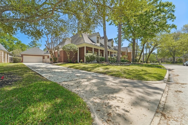 1706 Lofty Maple Trl, Houston, TX 77345 - view of front of house featuring driveway, a front yard, and brick siding
