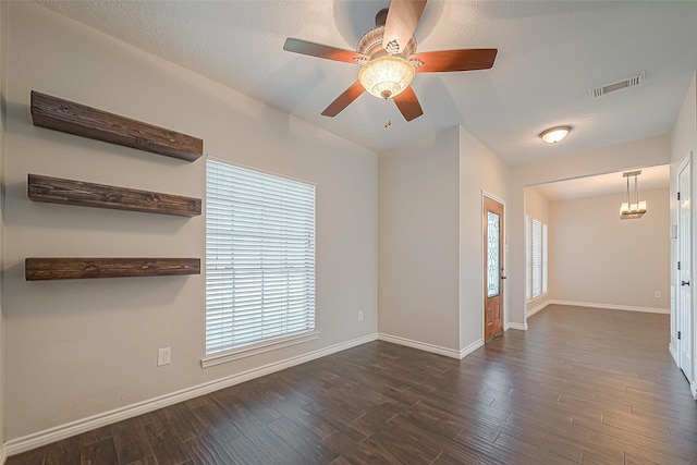 23123 Sandpiper Trl, Spring, TX 77373 - spare room with dark wood finished floors, baseboards, vaulted ceiling, and ceiling fan