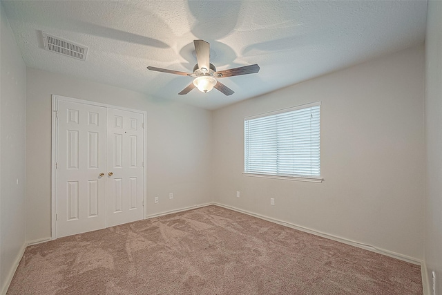 23123 Sandpiper Trl, Spring, TX 77373 - unfurnished bedroom with carpet, a closet, baseboards, and ceiling fan