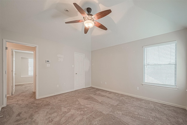 23123 Sandpiper Trl, Spring, TX 77373 - carpeted empty room with a ceiling fan, vaulted ceiling, and baseboards