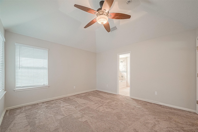 23123 Sandpiper Trl, Spring, TX 77373 - empty room with light carpet, a ceiling fan, vaulted ceiling, and baseboards
