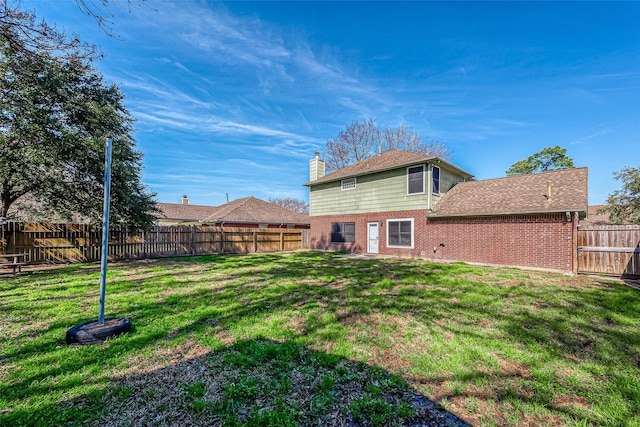 23123 Sandpiper Trl, Spring, TX 77373 - back of property featuring brick siding and a chimney