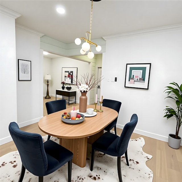 301 Tabor St, Houston, TX 77009 - dining room featuring crown molding, light wood-style flooring, and baseboards