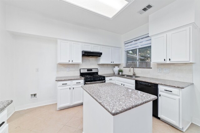 20415 Longspring Dr, Katy, TX 77450 - kitchen with stainless steel range with gas cooktop, under cabinet range hood, a sink, tasteful backsplash, and black dishwasher