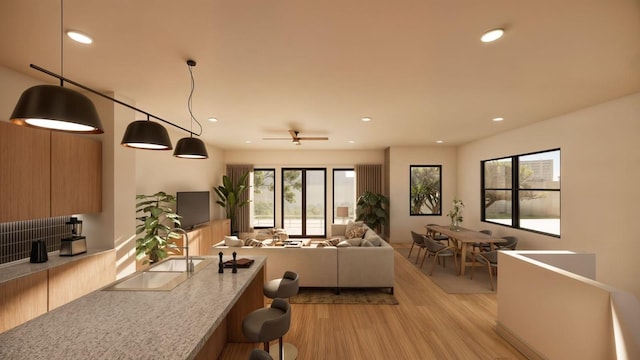 living room featuring light wood-type flooring, recessed lighting, and ceiling fan