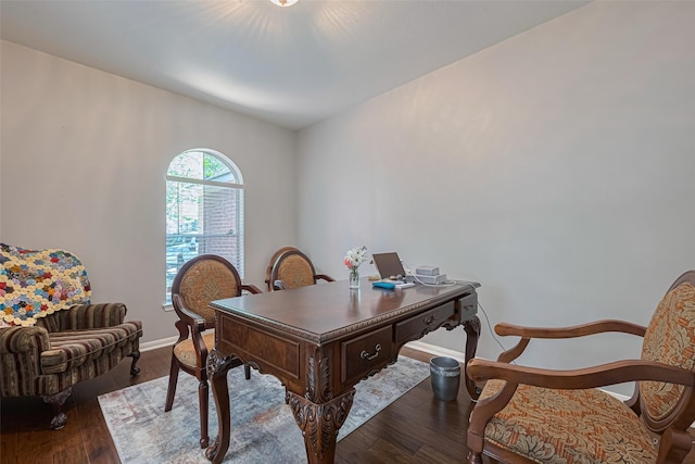 home office featuring baseboards and wood finished floors
