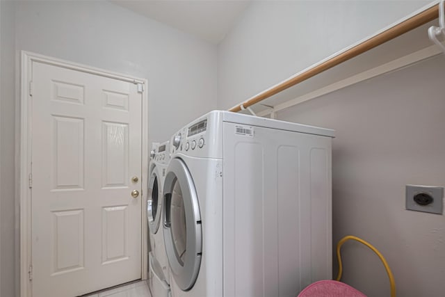 laundry room featuring washing machine and clothes dryer
