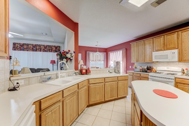 515 Deer Hollow Dr, Sugar Land, TX 77479 - kitchen featuring white appliances, a sink, decorative backsplash, light countertops, and light tile patterned flooring