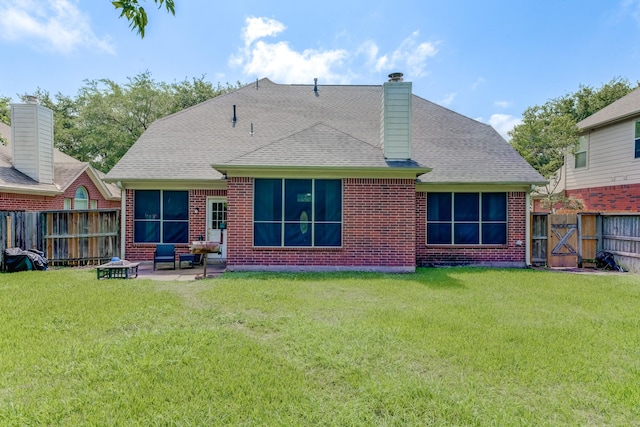 515 Deer Hollow Dr, Sugar Land, TX 77479 - back of house featuring roof with shingles, a patio area, brick siding, a chimney, and a gate