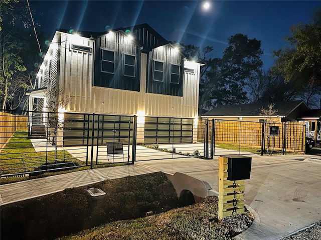 610 E 41st St Unit A B, Houston, TX 77022 - property exterior at night featuring fence