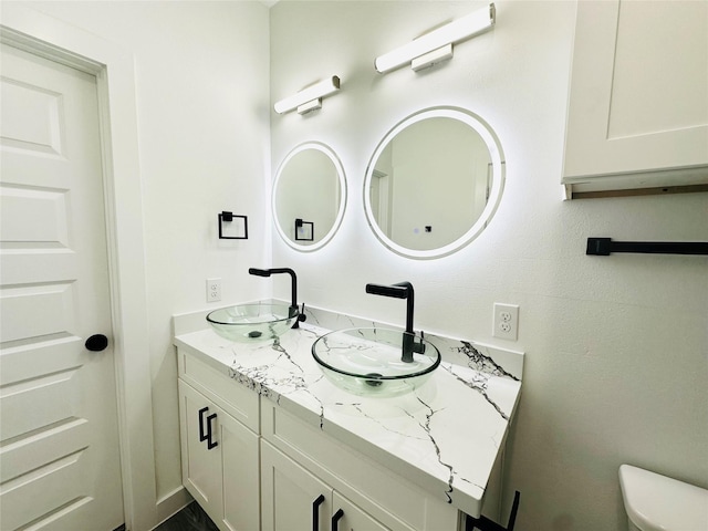 610 E 41st St Unit A B, Houston, TX 77022 - bathroom with double vanity and toilet